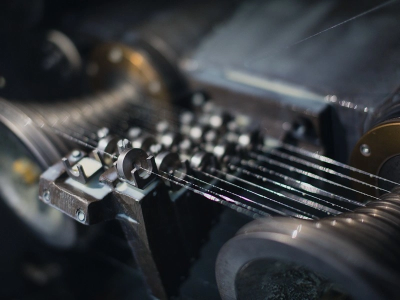 Knitted wire mesh production